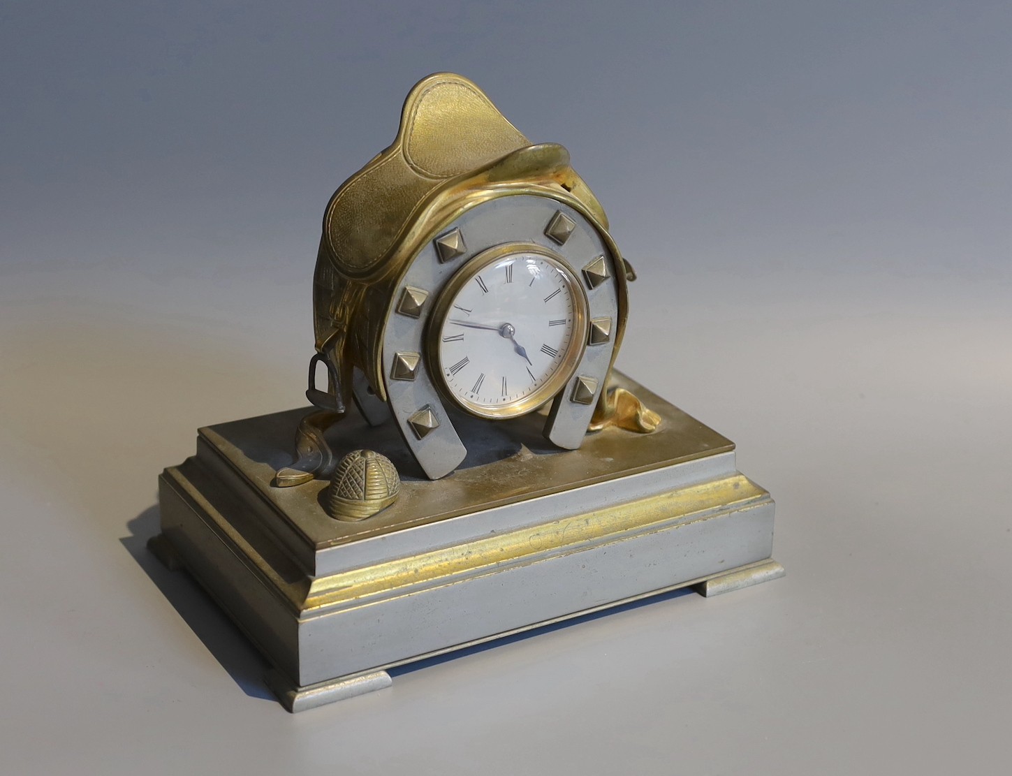 A Victorian brass metal equestrian themed desk timepiece, width 20cm height 19cm